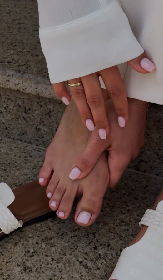 Matching manicure and pedicure in soft pink